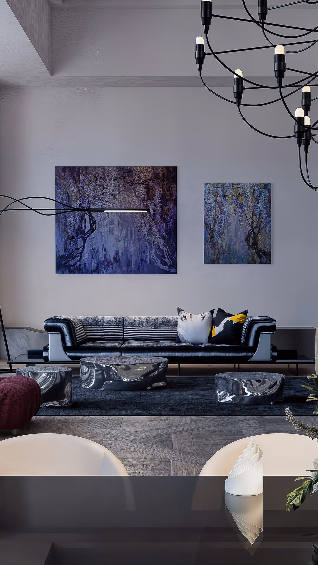 Blue is used as an accent tone to bring depth and vitality to the space. Organically shaped objects form an iconic composition, establishing a visual rhythm that transforms the room into a sculptural environment. A refined mix of fabric, aluminum, and black accents weaves together a contemporary aesthetic, presenting a space that is both sophisticated and design-forward.