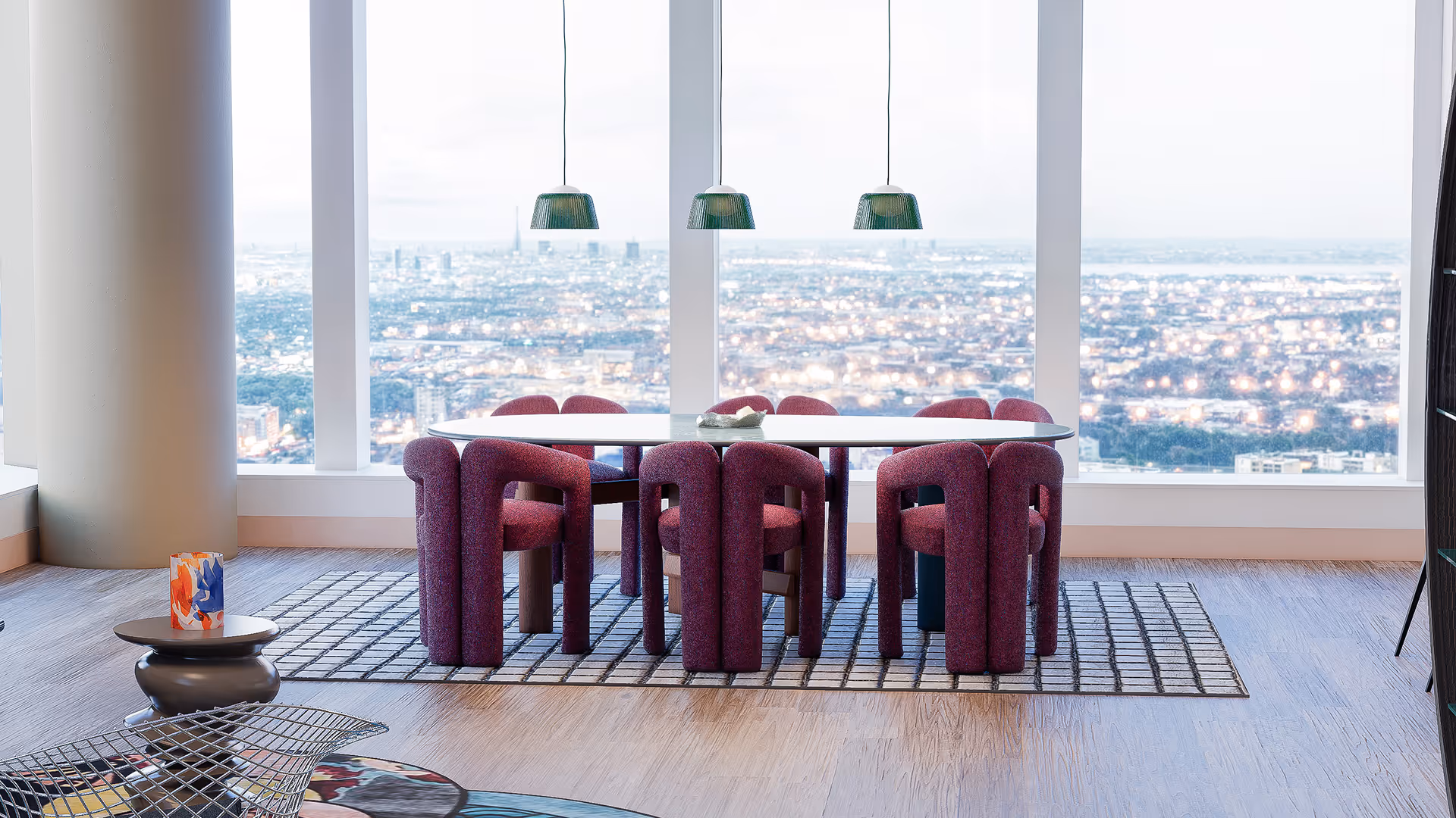 This dining space is anchored by a symmetrical composition, with a sculptural oval table and ten curved chairs precisely aligned along a central axis that frames sweeping skyline views. Above, three evenly spaced pendant lights introduce a vertical rhythm, while a grid-patterned rug below reinforces geometric balance and spatial clarity. The result is a refined, gallery-like atmosphere where architectural order and visual harmony elevate the dining experience.