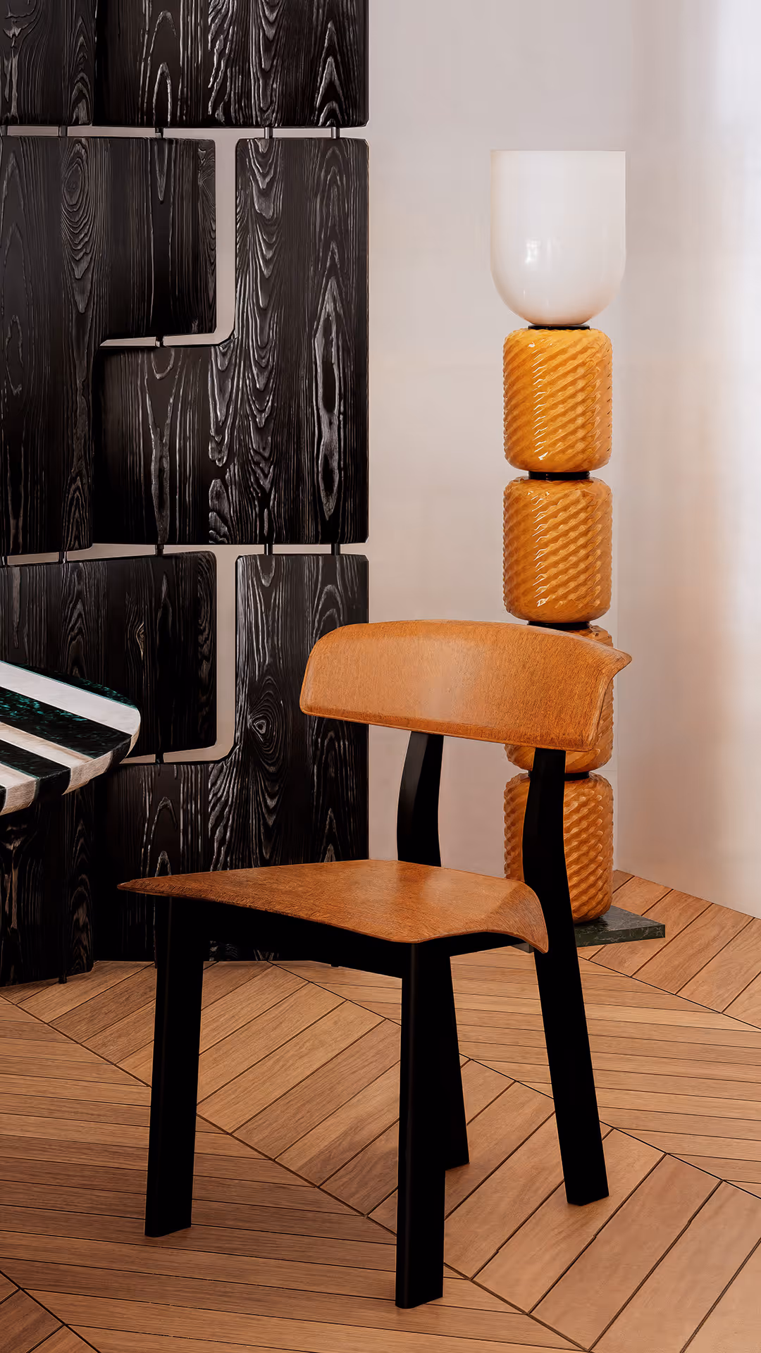 This dining chair combines ergonomic curves with the refined texture of genuine leather, delivering both elegance and everyday functionality. The backrest and seat are gently contoured to support the body naturally, ensuring long-lasting comfort even during extended periods of sitting. The leather upholstery offers not only durability and breathability but also a timeless, tactile warmth that adapts well across all seasons. Visually, the rich camel tone of the leather softens the aesthetic, while the contrasting black legs bring a bold modern edge. Minimal in embellishment yet rich in shape, the chair serves as a sculptural anchor within the dining space, elevating its visual rhythm and tactile appeal.