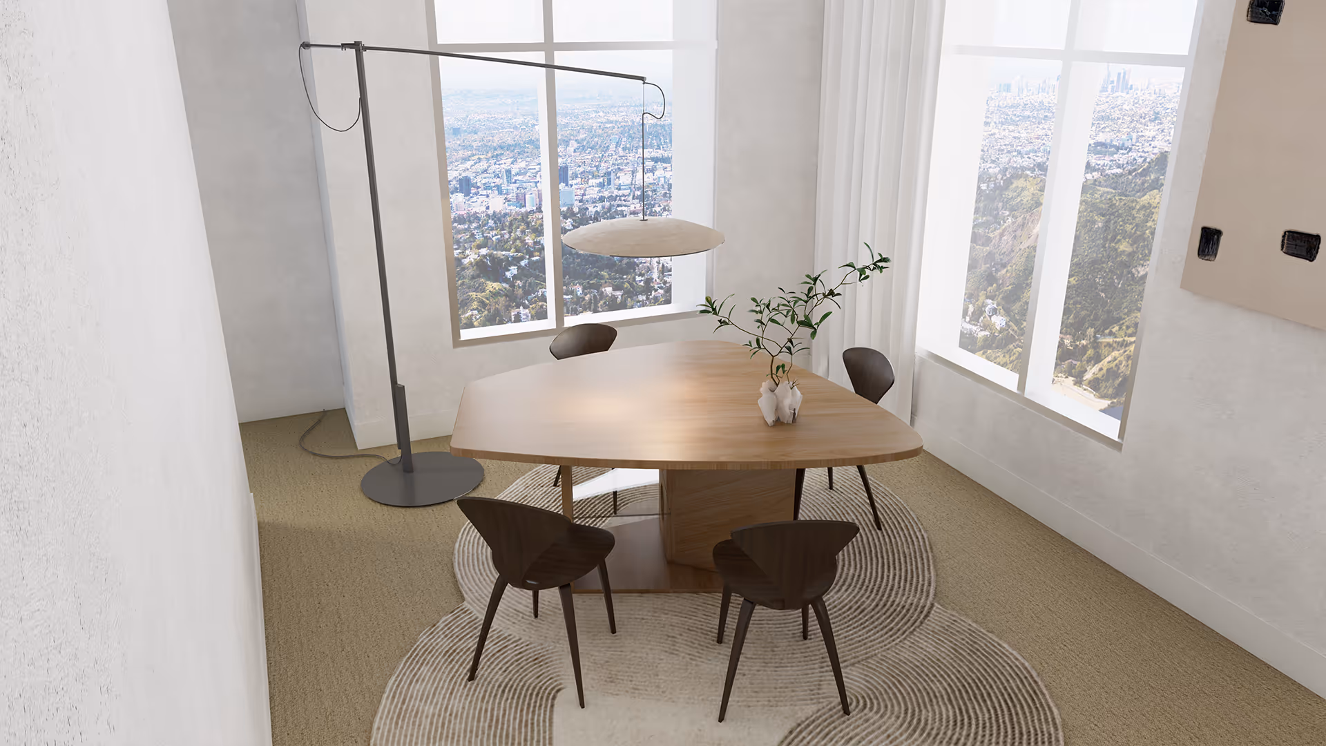 Viewed at a distance, the dining area reveals its thoughtful symmetry and sculptural layering. The organic rug gently outlines the seating zone, visually anchoring the table and chairs. A muted art piece on the wall and the quiet presence of a textured lounge chair complete the composition, making the space feel curated yet lived-in.