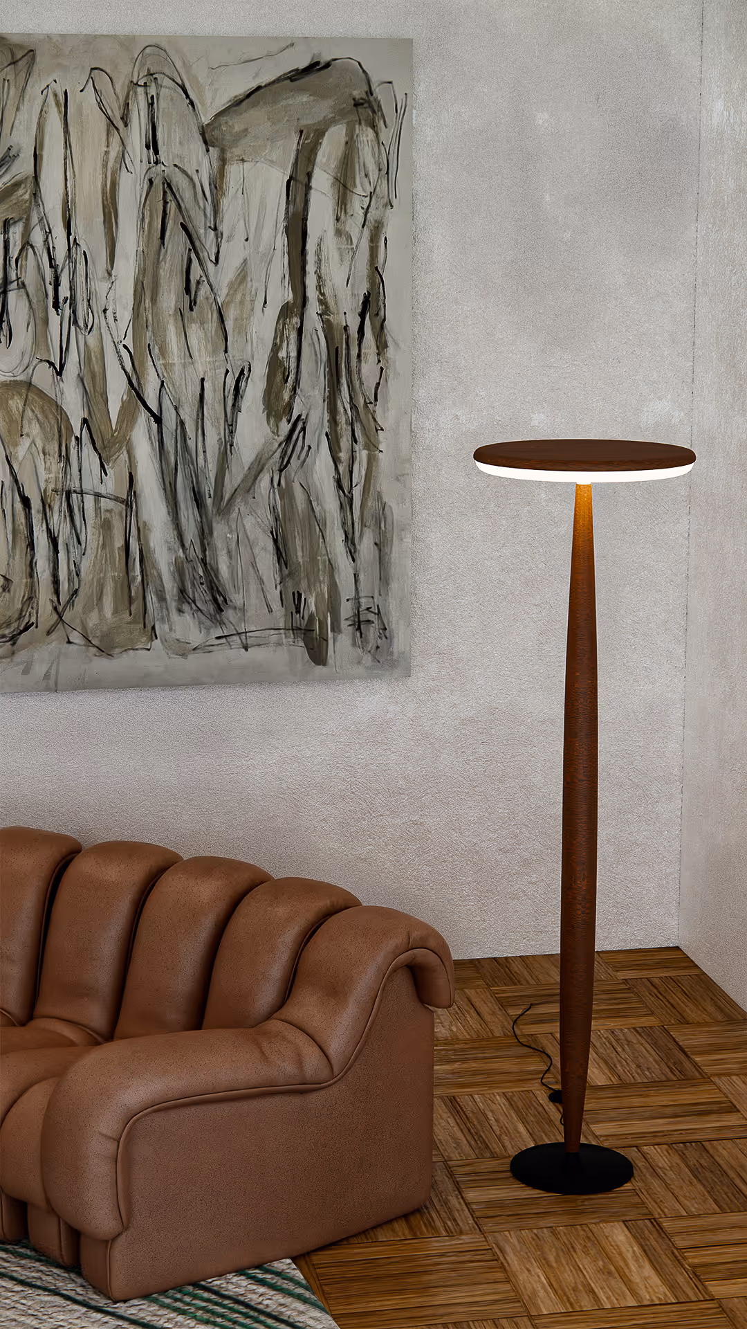 Here, indirect lighting highlights the sculptural silhouette of the sofa and casts gentle shadows that emphasize the material layers. The balance of warm leather, natural flooring, and soft illumination achieves a sense of refined ease.